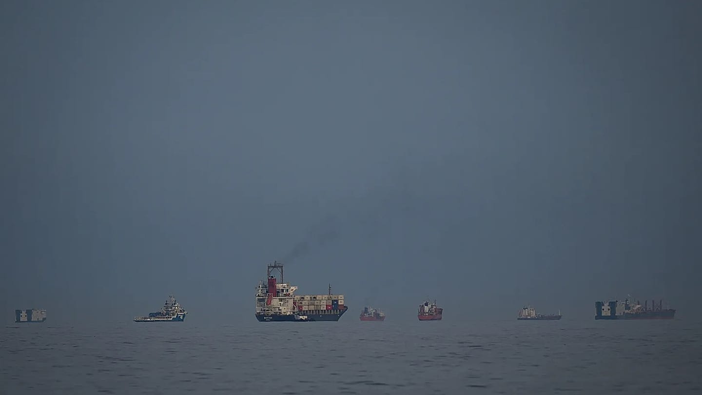 Tankers queue in the Strait of Hormuz — two observed at Kharg Island hours after US strikes, signaling oil export route not severed