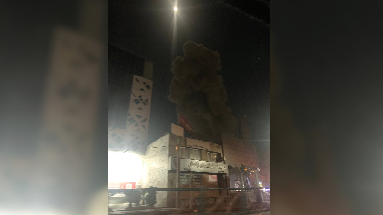 IRIB state broadcaster HQ — smoke rising after IDF strike
