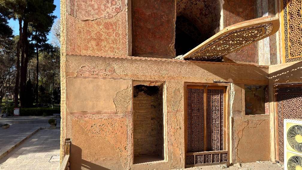 Intricately carved wooden window destroyed at Isfahan UNESCO heritage site — Ali Qapu Palace doors and windows shattered