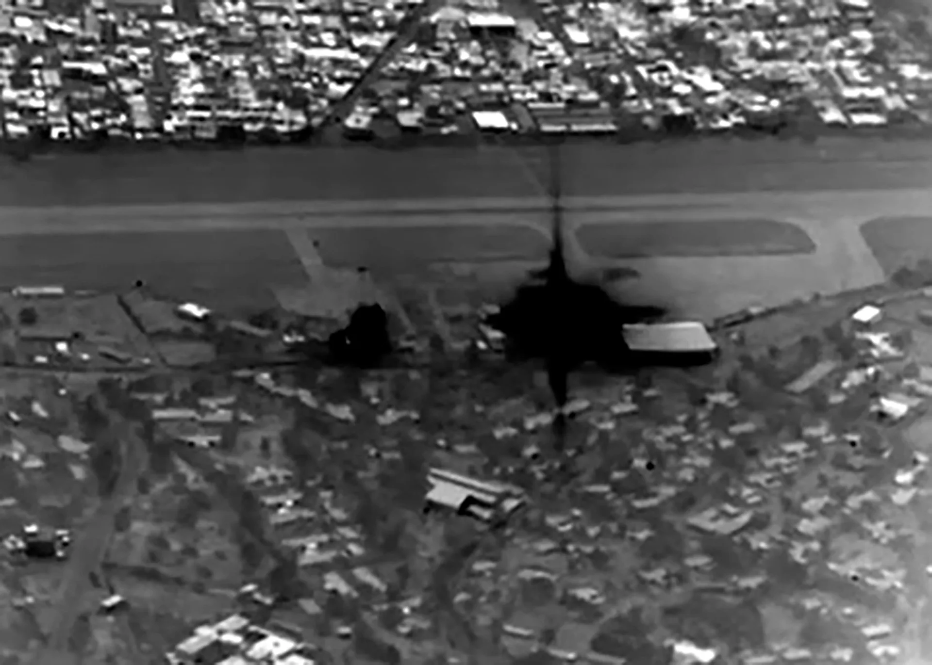 Kharg Island airbase and military runway destroyed in US strikes — oil export infrastructure visible intact in background